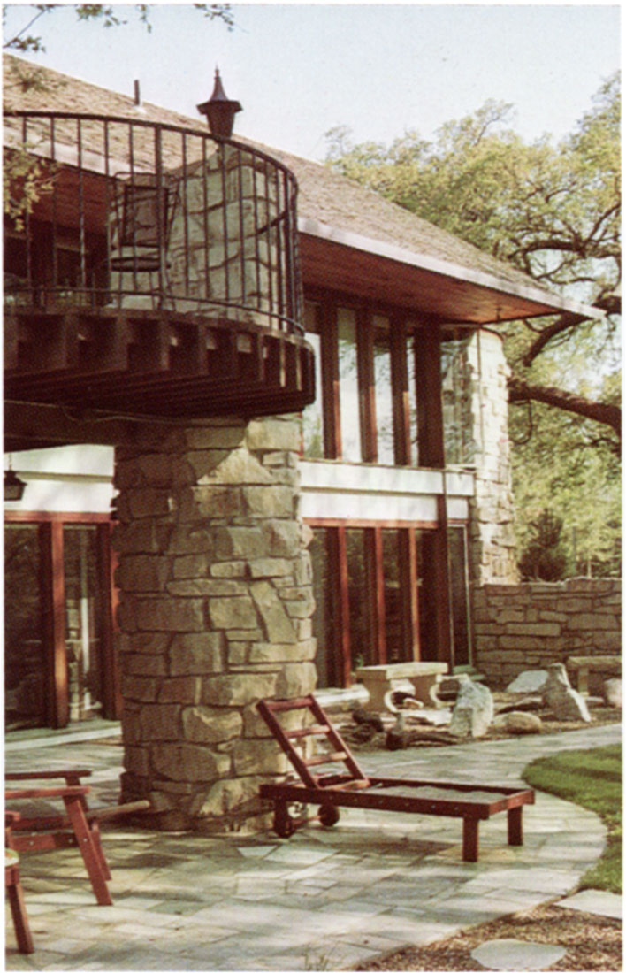 Color photo of an attractive mixture of Cresswell stone and other building material is exhibited at this home in Wichita.