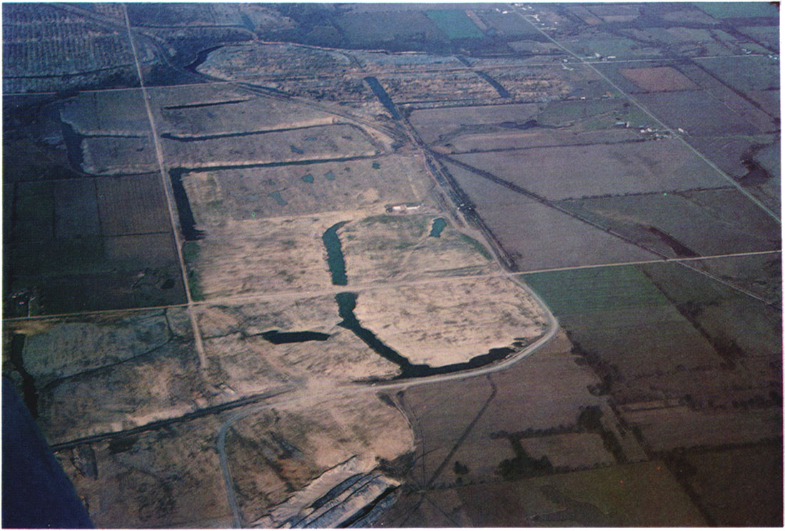 An aerial view from the south showing the mine site, December 1975.