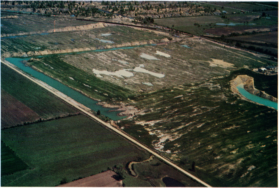 Aerial view of northern half of Field 1 (Lower right) showing acid areas devoid of wheat, May 1976.