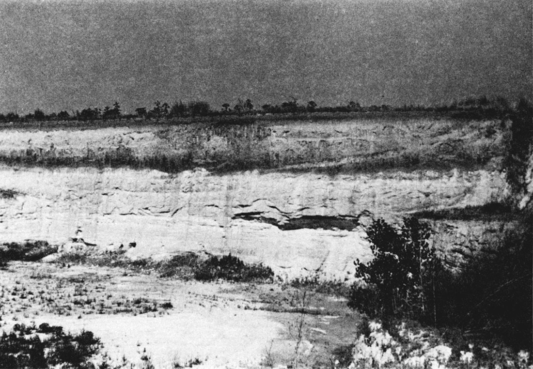 Black and white photo of volcanic ash pit in Clark County (Sec. 23, T. 30 S., R. 24 W.).