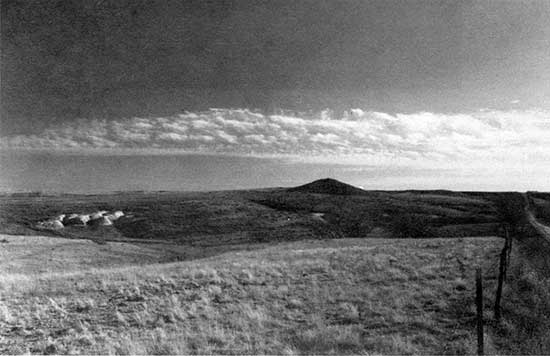 Black and white photo of hill composed of Ogallala Formation.