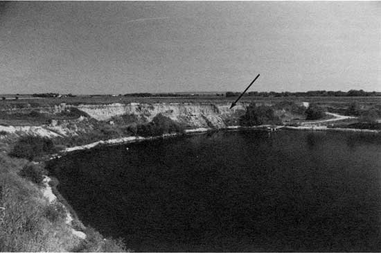 Black and white photo of Kirwin terrace and fill exposed in the Siebert gravel pit.