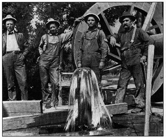 Black and white photo of flowing wells in the Dakota aquifer in southeastern Colorado.