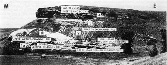 Black and white photo of Dakota outcrop on hillside.