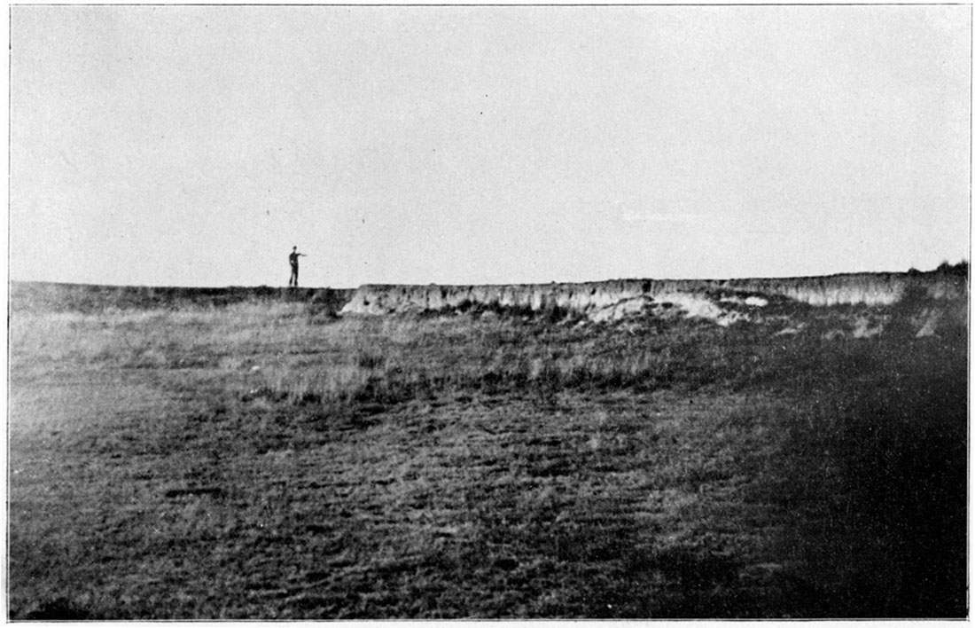 Black and white photo: source of an arroyo in the Tertiary of Meade County.