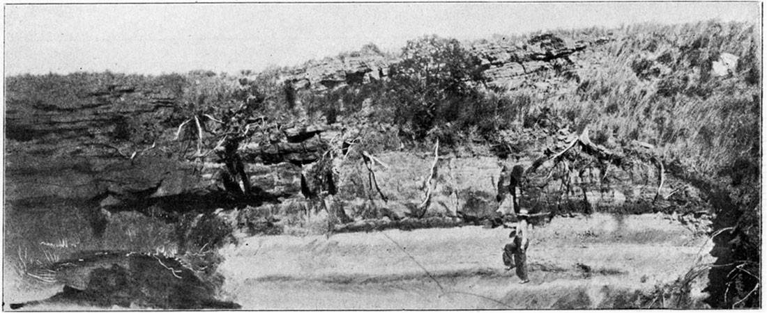 Black and white photo: Contact of Cheyenne Sandstone and Red-Beds Showing unconformability, western side Barber County.