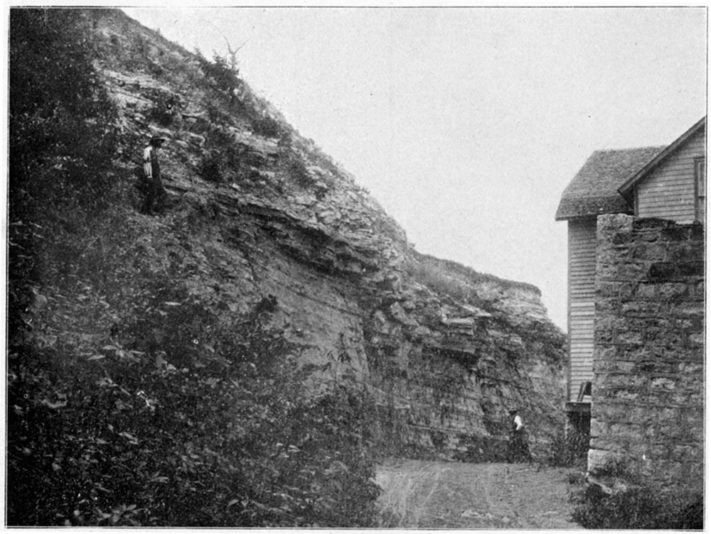 Black and white photo: Niobrara bluff capped with chert, at old mill, Norton.