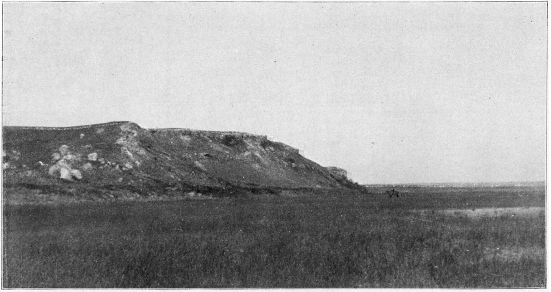 Black and white photo: basin sandstone resting on Red-Beds, on Sand Creek, near Cash City, Clark County.