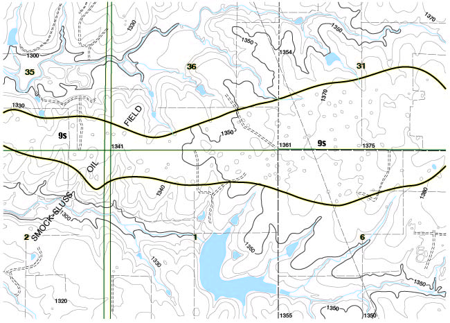 Black and white geologic map showing sinkhols withing unit 9s outline.