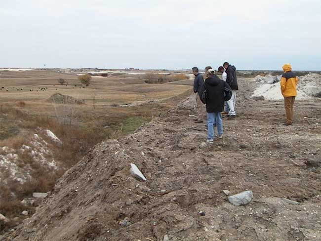 winter day, students collecting GPS data at landfill