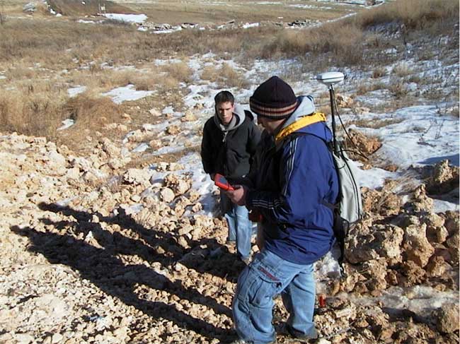 winter day, students collecting GPS data at landfill