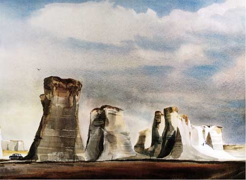 Painting of tall isolated towers of chalk; blue-gray cloudy sky is large part of painting.