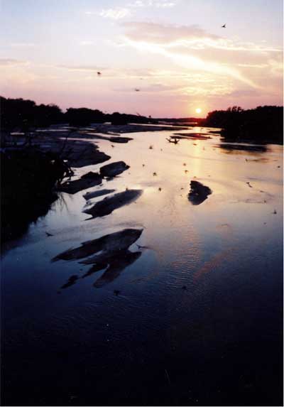 Photo of sunset over slow river.