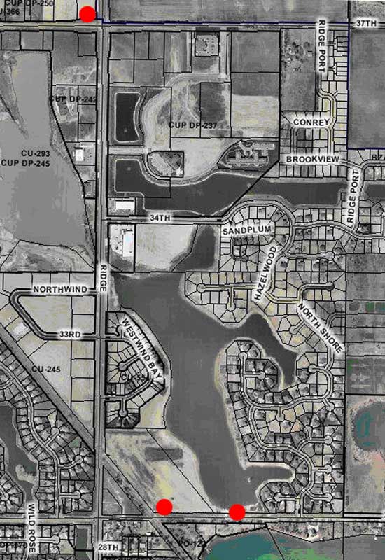 Aerial photo of example pit; two monitoring wells were placed at downgradient end of pit and one upgradient.