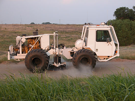 Color photo of IVI Minivib, a vehicle used to generate seismic energy for exploration.