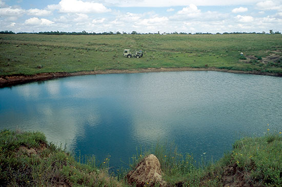 Color photo of sinkhole near Macksville.