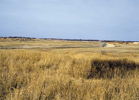 Phot of gentle hills covered with grass