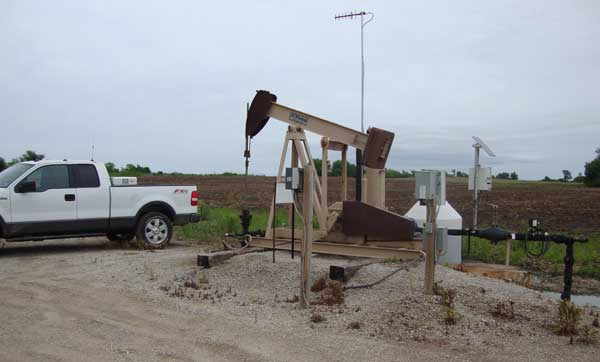 Photo of pumpjack pumping out water from well.